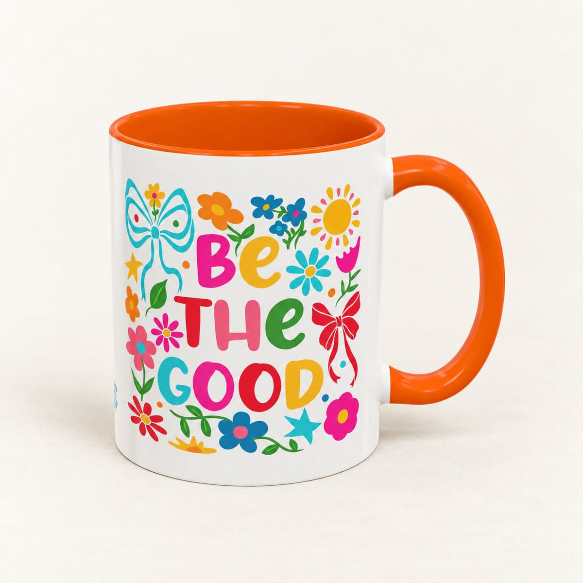 Be the Good Floral Coffee Mug on warm off-white background