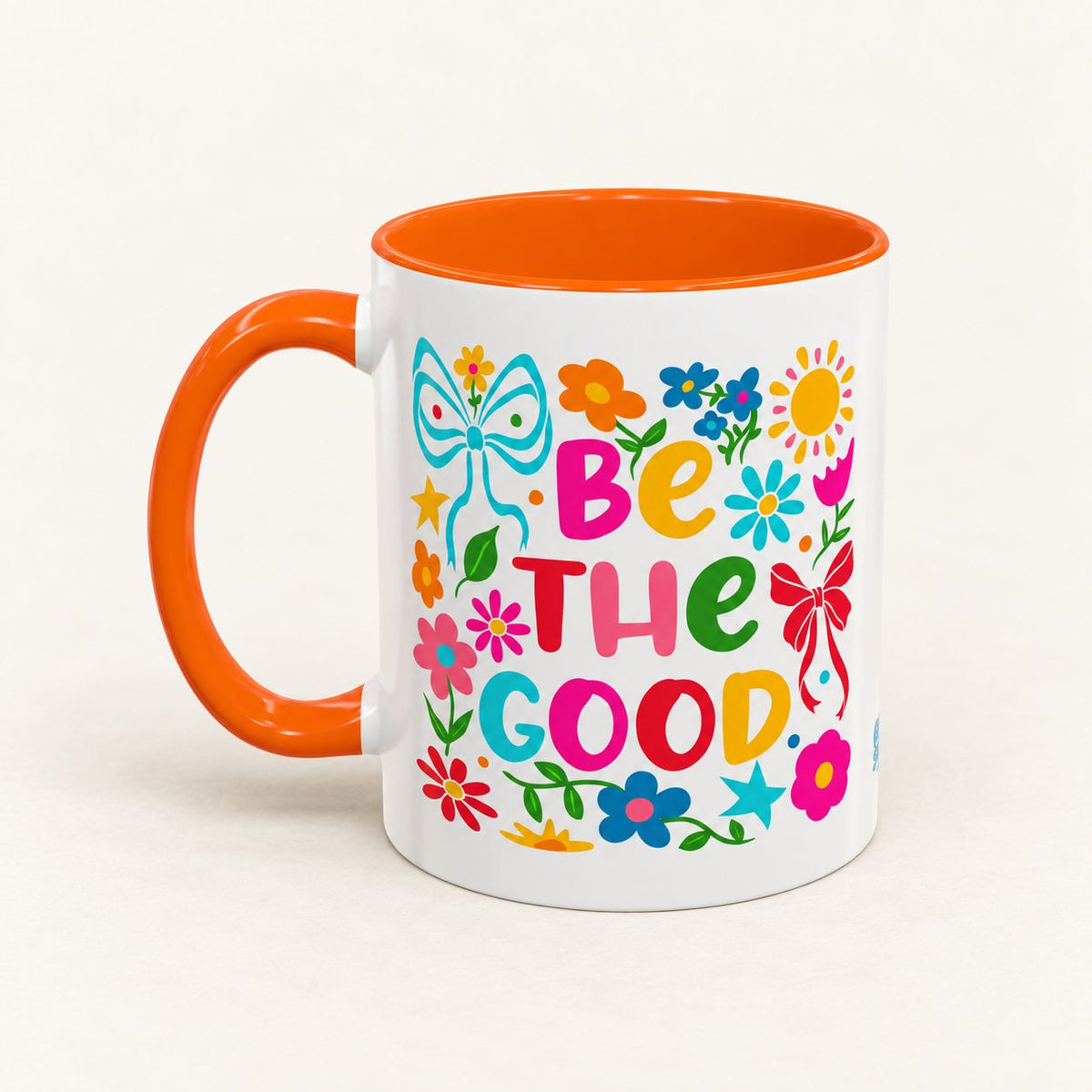 Be the Good Floral Coffee Mug on warm off-white background