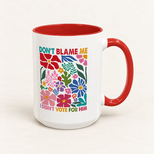 Don’t Blame Me I Didn’t Vote For Him Coffee Mug, 15 oz, on a warm off-white background
