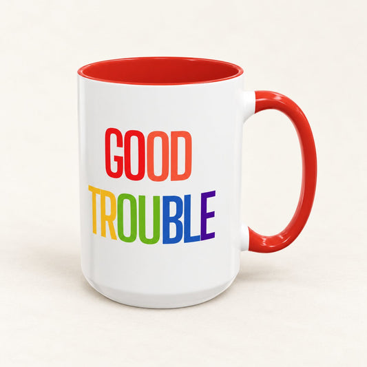 Good Trouble Coffee Mug on warm off-white background