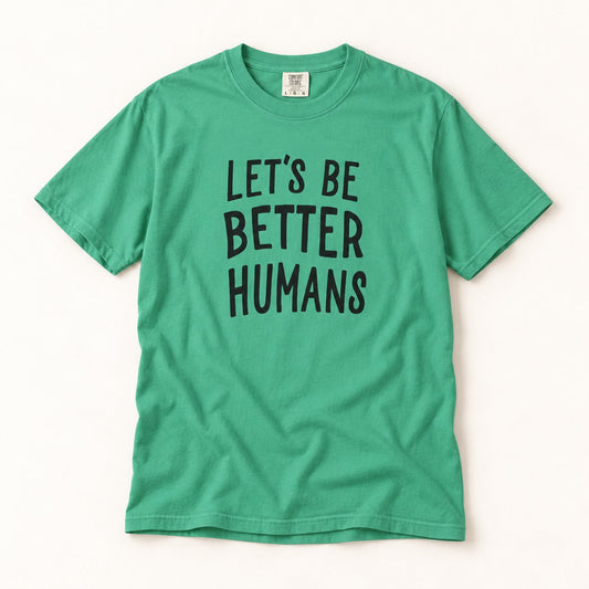 Let's Be Better Humans T-Shirt, product photo on warm off-white background