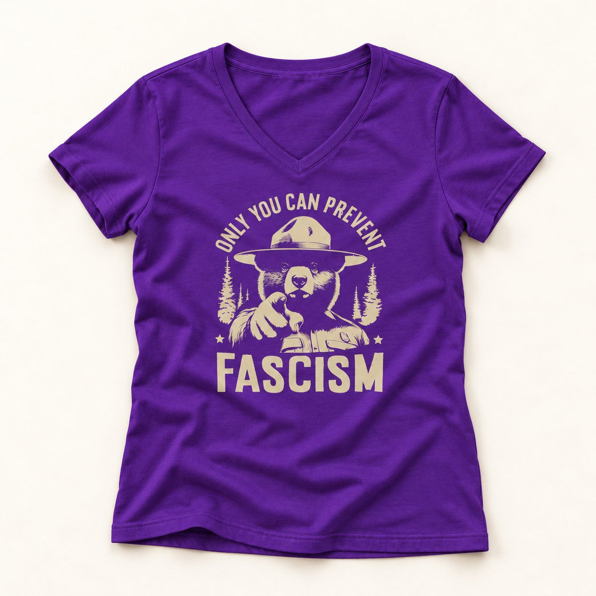 Only You Can Prevent Fascism V-Neck T-Shirt in Purple, flat lay on warm off-white background