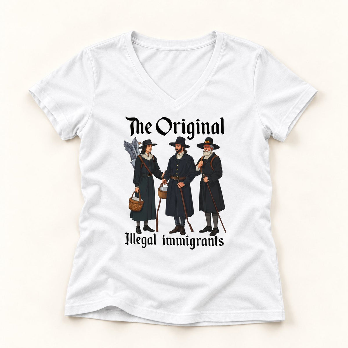 The Original Illegal Immigrants V-Neck T-Shirt in White, flat lay on warm off-white background