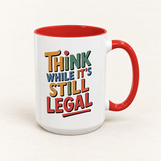 Think While It's Still Legal Coffee Mug on warm off-white background