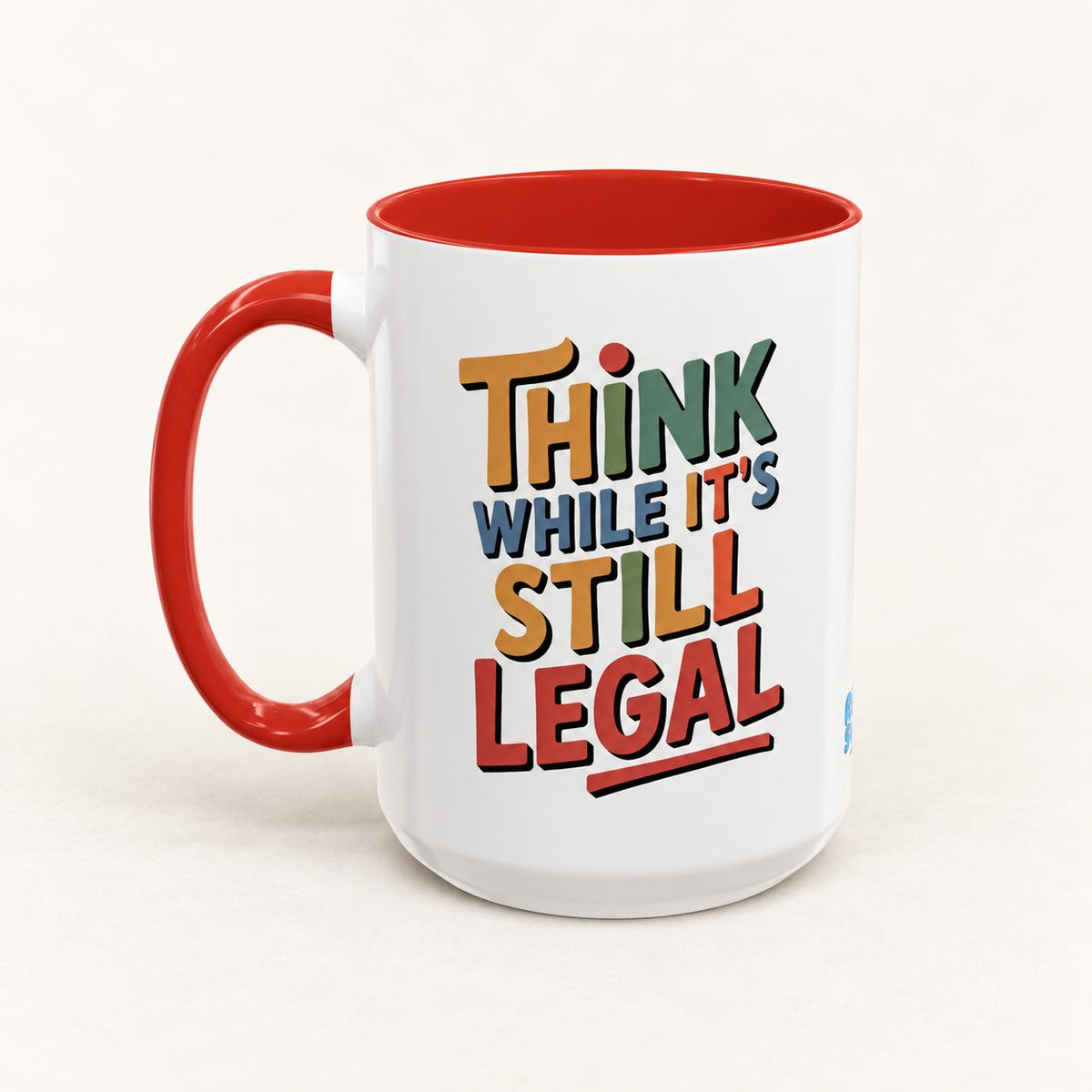 Think While It's Still Legal Coffee Mug on warm off-white background
