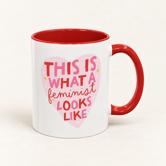 This Is What a Feminist Looks Like Coffee Mug, 11 oz, on a warm off-white background