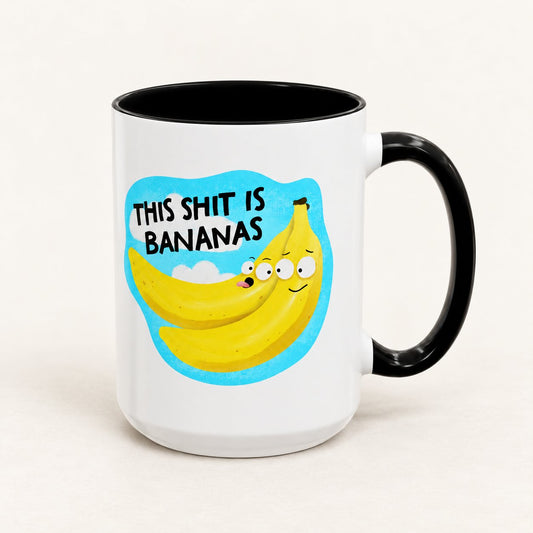 This Sh*t Is Bananas Coffee Mug, 15 oz, on a warm off-white background