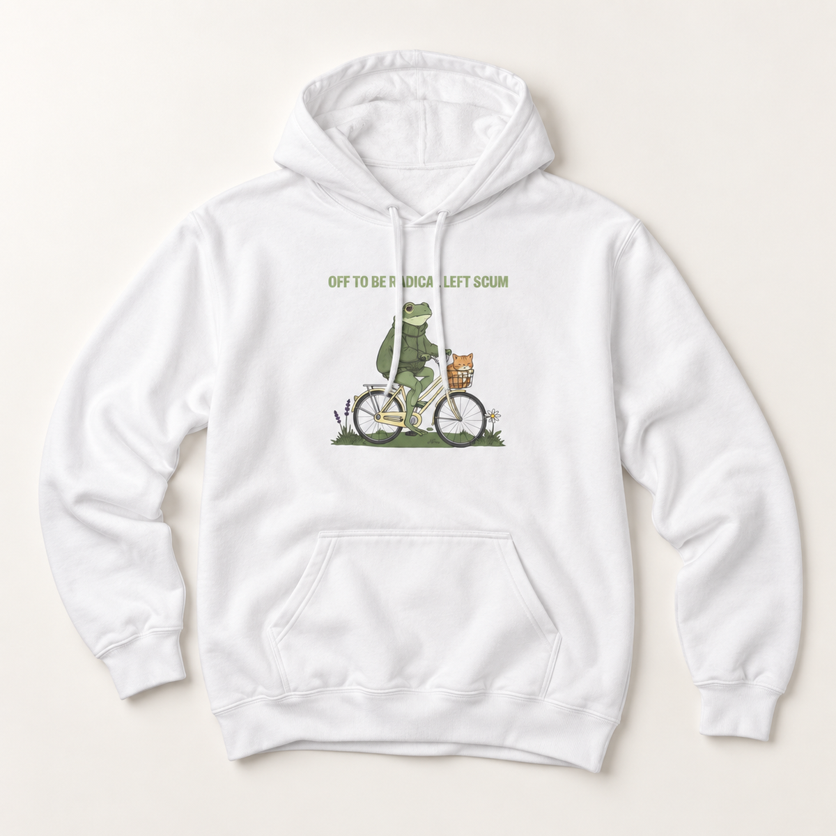 A white pullover hoodie with a front kangaroo pocket and drawstring hood, featuring a graphic of a green frog riding a bicycle with the text 'OFF TO BE A ROKA LEFT SCUM' printed on the chest, displayed on a light beige background.
