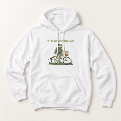 A white pullover hoodie with a front kangaroo pocket and drawstring hood, featuring a graphic of a green frog riding a bicycle with the text 'OFF TO BE A ROKA LEFT SCUM' printed on the chest, displayed on a light beige background.