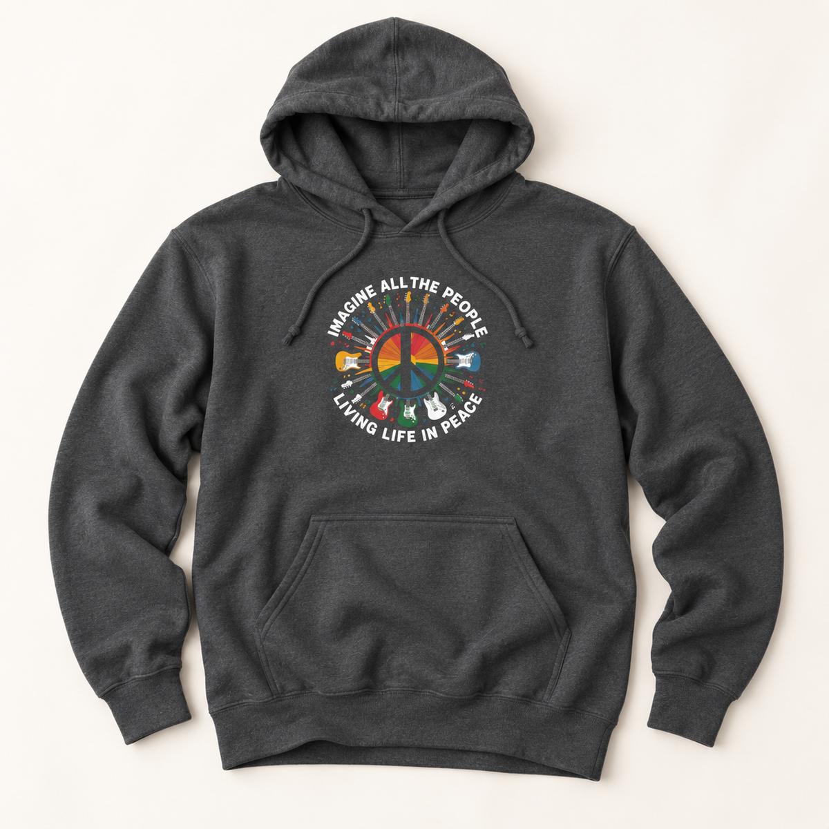 A dark heather gray hoodie with a colorful peace sign graphic on the chest, featuring the text 'IMAGINE ALL THE PEOPLE LIVING LIFE IN PEACE' and small peace-themed icons radiating from the center, shown on a light beige background.