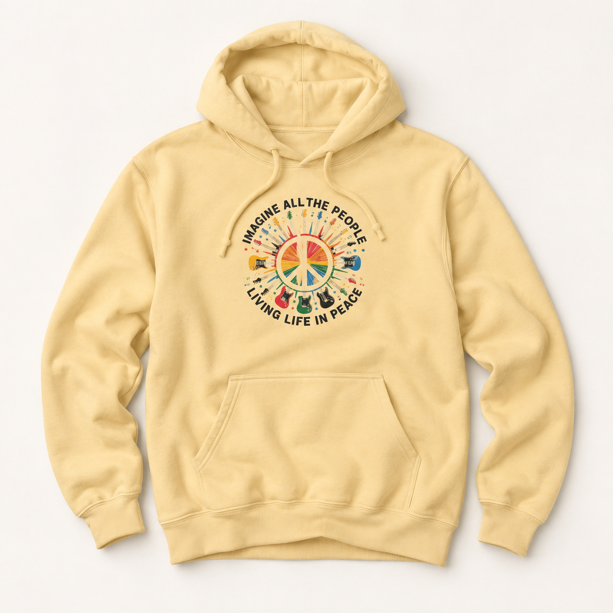 A pale yellow pullover hoodie with a colorful peace sign graphic on the chest, featuring the text 'IMAGINE ALL THE PEOPLE LIVING LIFE IN PEACE' and small illustrations of musical instruments and people.