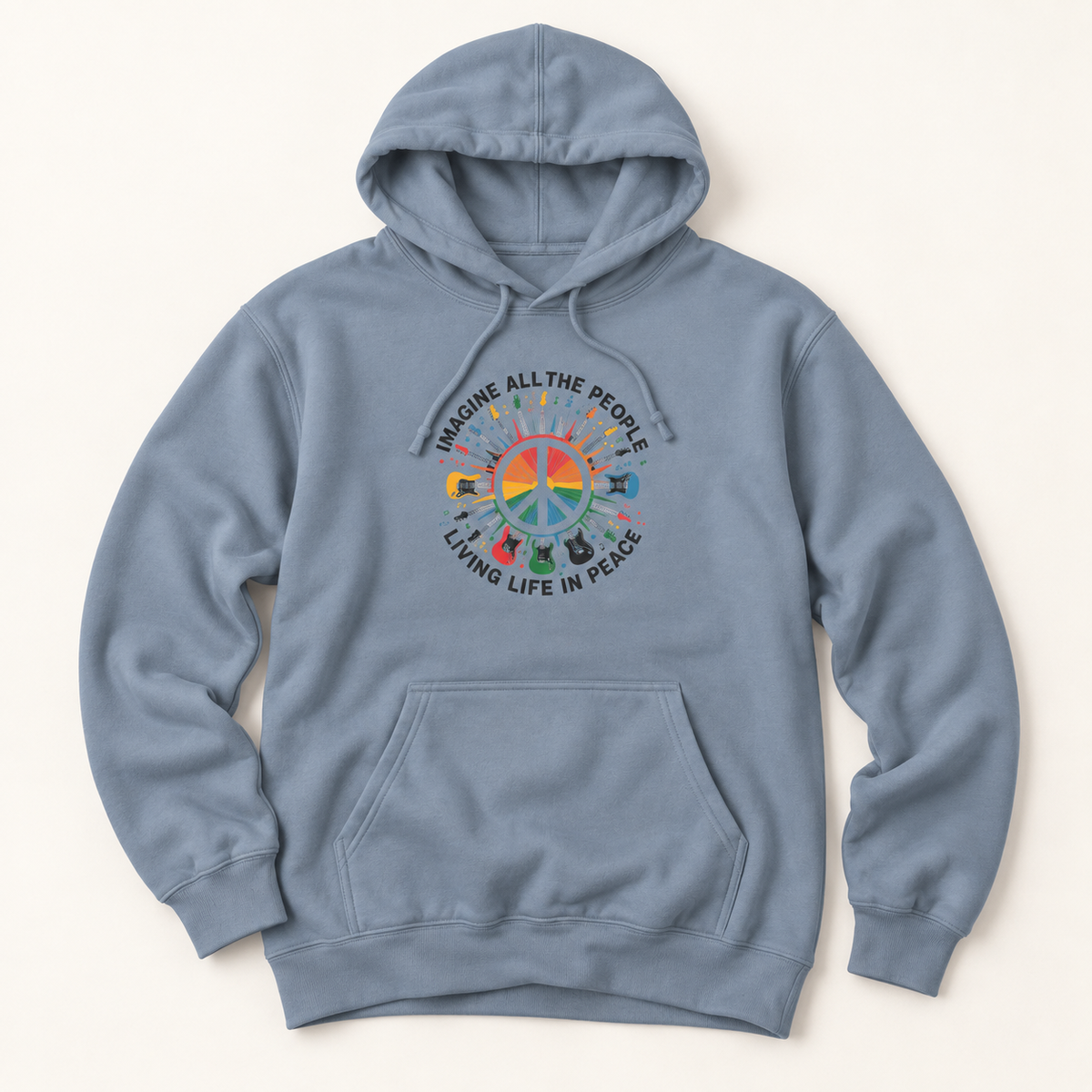 A dusty blue pullover hoodie with a colorful peace sign graphic and the text 'IMAGINE ALL THE PEOPLE LIVING LIFE IN PEACE' printed on the chest, displayed against a light cream background.