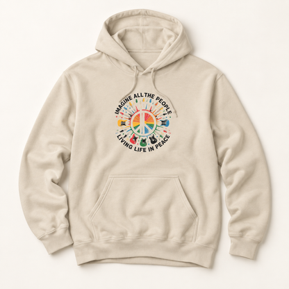 A light beige pullover hoodie with a colorful peace sign graphic on the chest, featuring the text 'IMAGINE ALL THE PEOPLE LIVING LIFE IN PEACE' and a rainbow of peace-themed icons, shown against a plain off-white background.