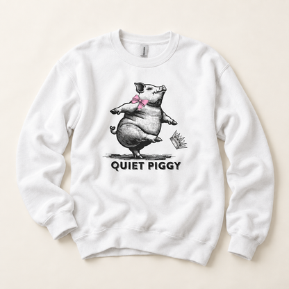 A white crewneck sweatshirt featuring a black and gray sketch of a pig dancing with a pink bow tie, with the text 'QUIET PIGGY' printed below in black. The sweatshirt is laid flat on a light beige background.