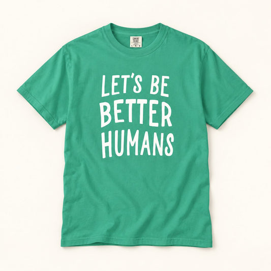 Let's Be Better Humans T-Shirt, product photo on warm off-white background