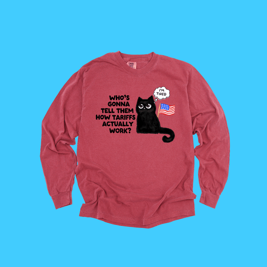 Long Sleeve T-Shirt — Cute Black Cat with US Flag ‘Who’s Gonna Tell Them How Tariffs Actually Work?’ - Resist Supply